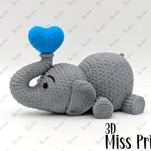 Elefante de punto soplando un corazón (N°2)