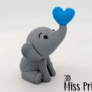 Elefante de punto lanzando un corazón